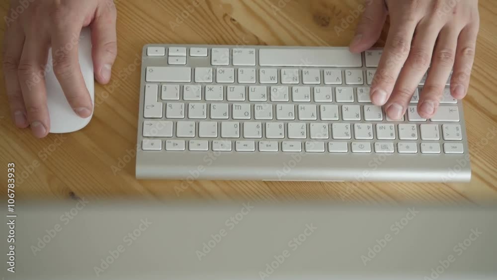Top View of Business Workspace with Hands Typing on Computer Top View of Business Workspace with Hands Typing on Computer