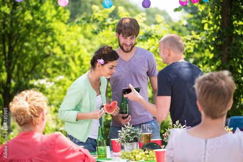 Family on a garden party photo