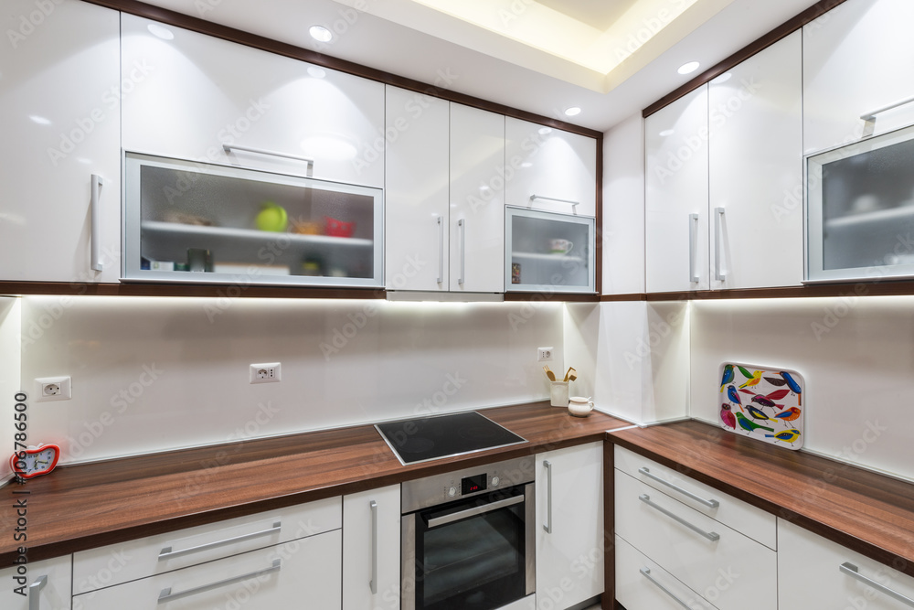 Big white kitchen in modern apartment Big white kitchen in modern apartment