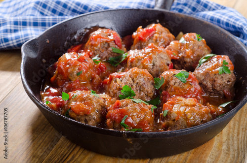 Beef Meatballs with Tomato Sauce on a pan.