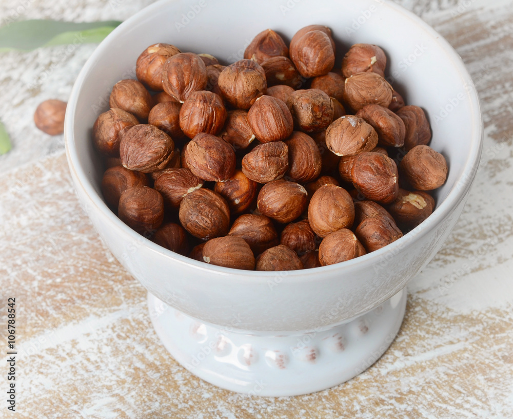 Hazelnuts in a white bowl Hazelnuts in a white bowl