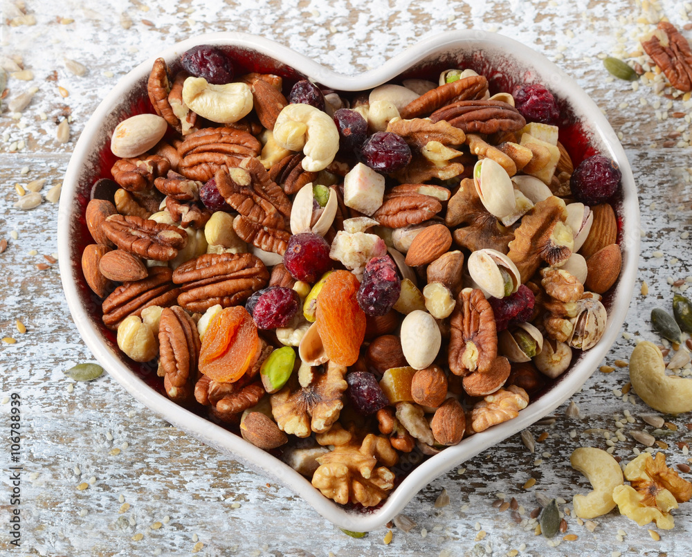 Nuts on heart plate. Healthy diet eating. Nuts on heart plate. Healthy diet eating.