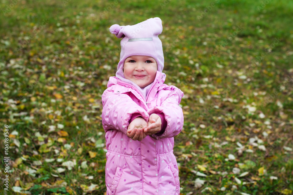 Little girl Playing in Autumn Park Leaves Little girl Playing in Autumn Park Leaves