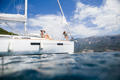 girls yachting and photograph sea cruise vacation