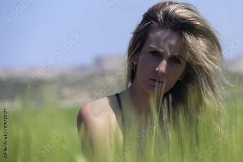 pretty blonde girl posing in the desert