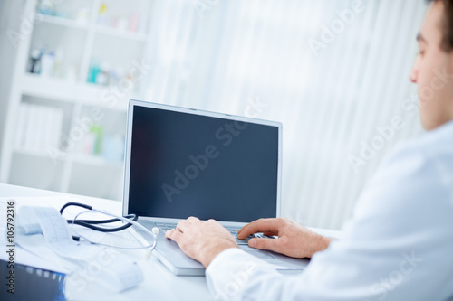 Doctor with notebook on the desk
