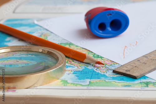 Fotografie Map, pencil and magnifying glass
