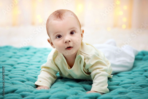Lovely baby on turquoise kn...