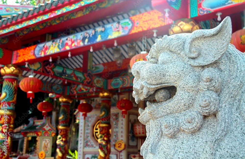 White chinese guardian lion with chinese temple background