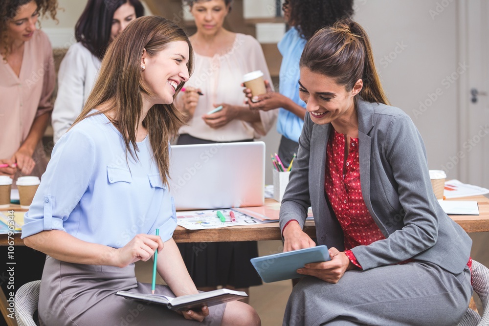 Group of interior designer interacting with each other Group of interior designer interacting with each other