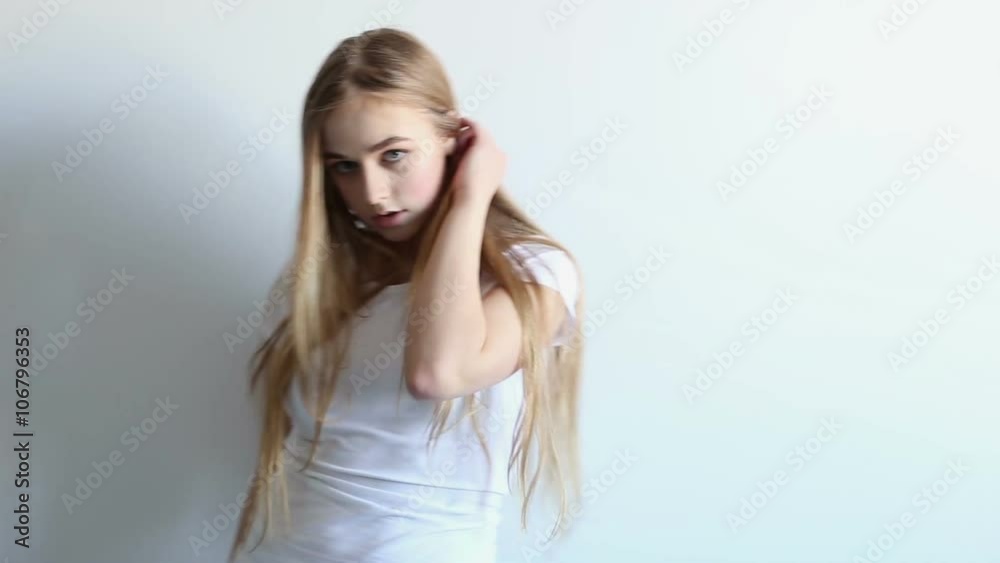 beautiful sexy young girl posing in the studio on a white background beautiful sexy young girl posing in the studio on a white background