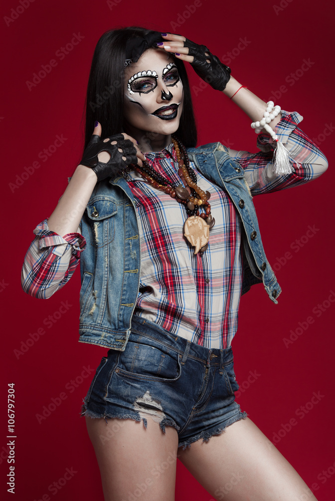 Beautiful sexy brunette model woman.Look zombie. Creative make up. Helloween concept. On red background Beautiful sexy brunette model woman.Look zombie. Creative make up. Helloween concept. On red background