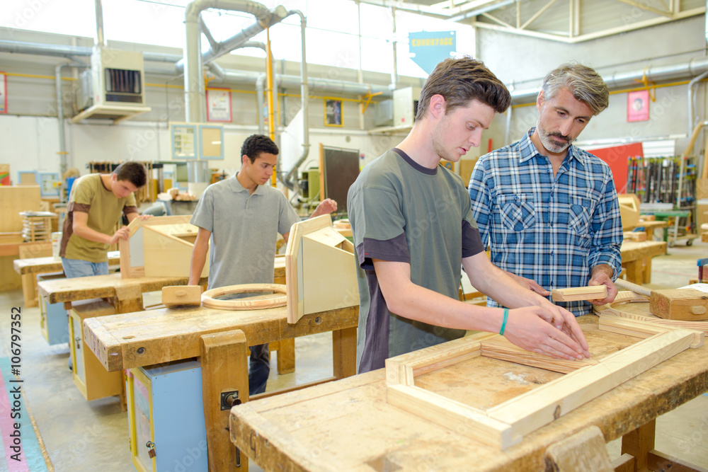 Students in a woodwork class - obrazy, fototapety, plakaty 