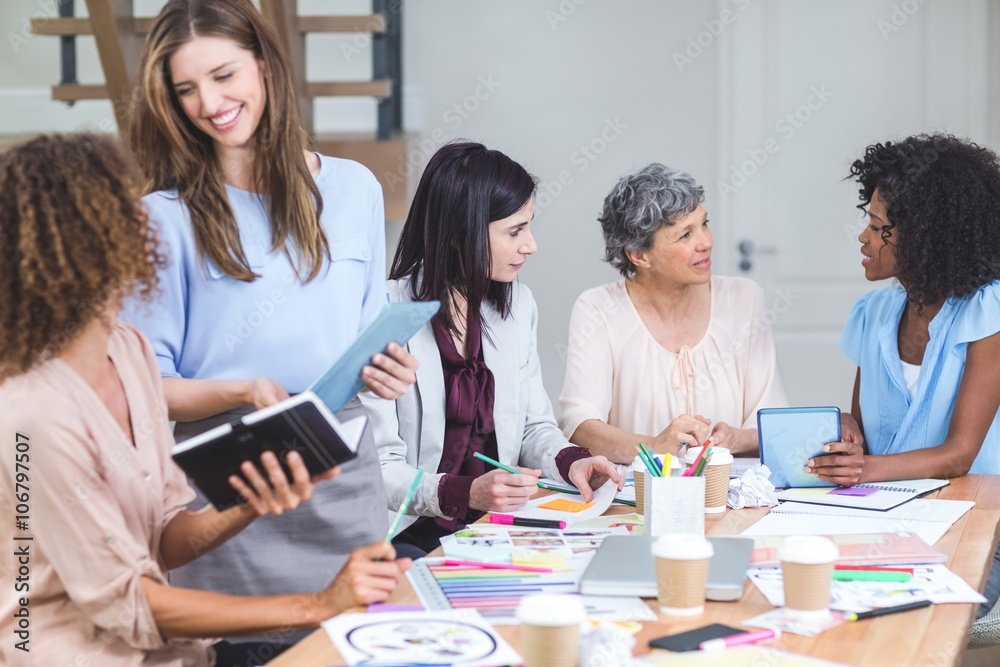 Group of interior designers interacting with each other Group of interior designers interacting with each other