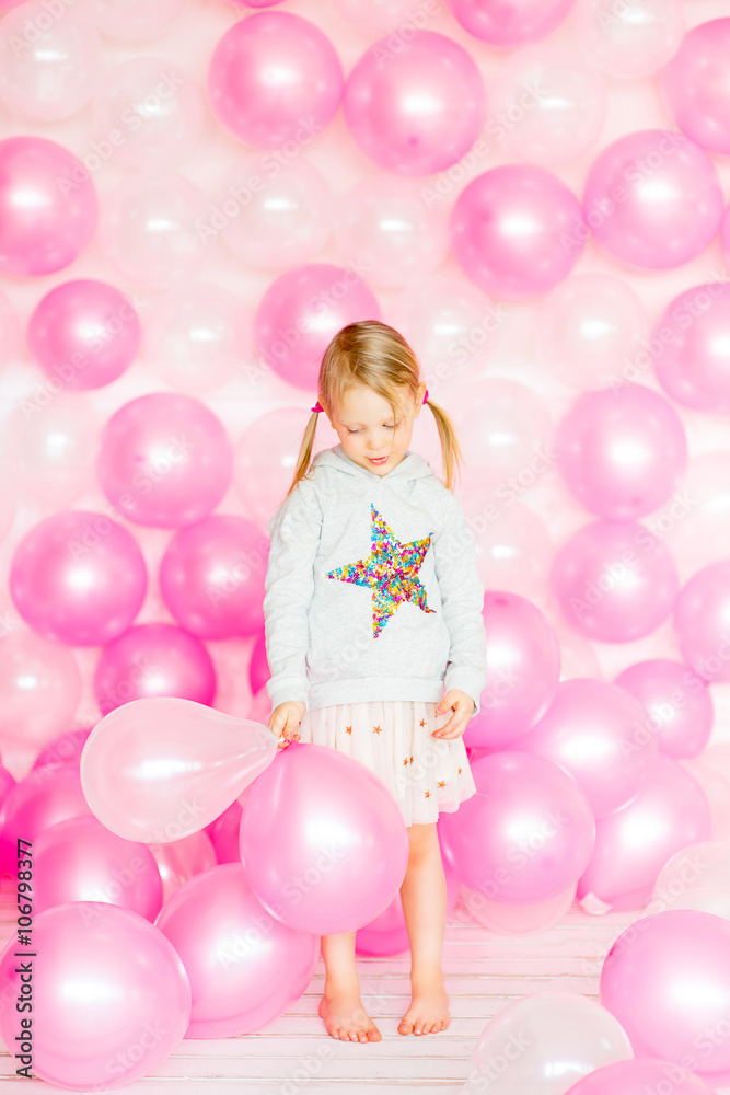 little girl playing with pink balloons little girl playing with pink balloons