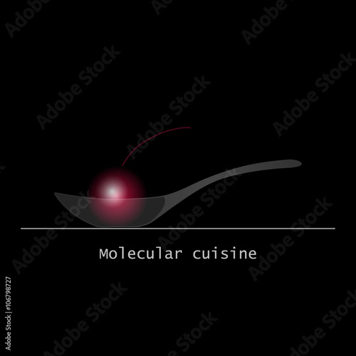 Molecular food ball on glass spoon isolated on black background photo