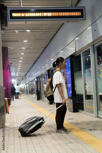Photography Woman with luggage waiting on the platform
