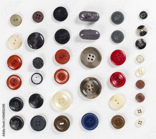 Collection of various sewing button on white background.