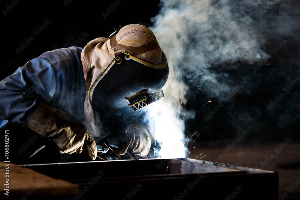Worker fabricate structure by flux cored wire arc welding process Worker fabricate structure by flux cored wire arc welding process