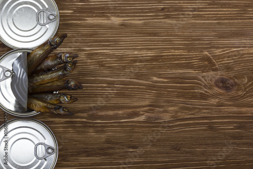 Close-up of Tinned capelin fish on wooden background