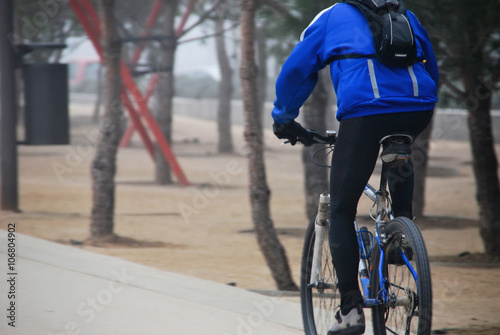 A biker in an urban park