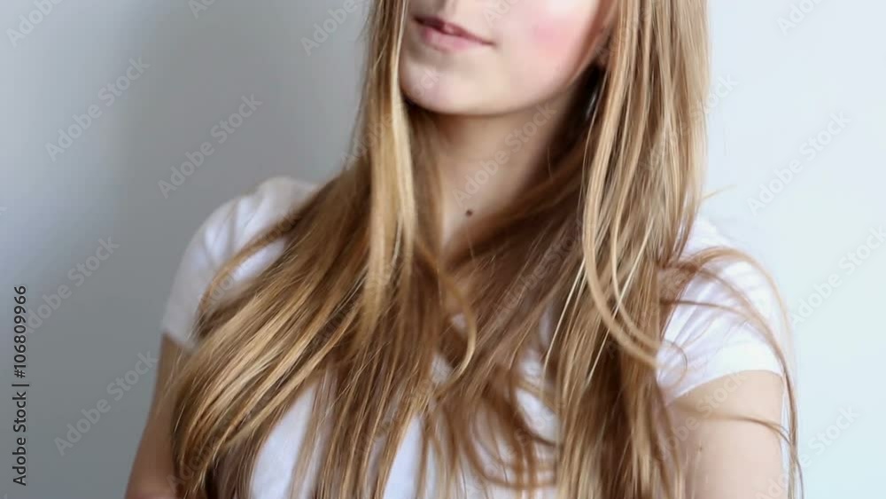 beautiful sexy young girl posing in the studio on a white background Stock Video | Adobe Stock