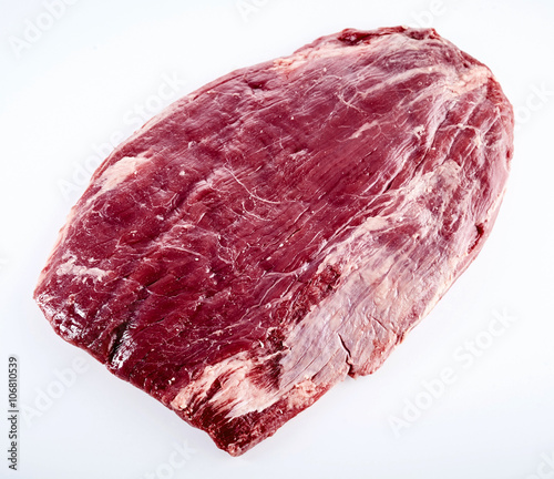 Prime cut of raw matured beef flank steak photo