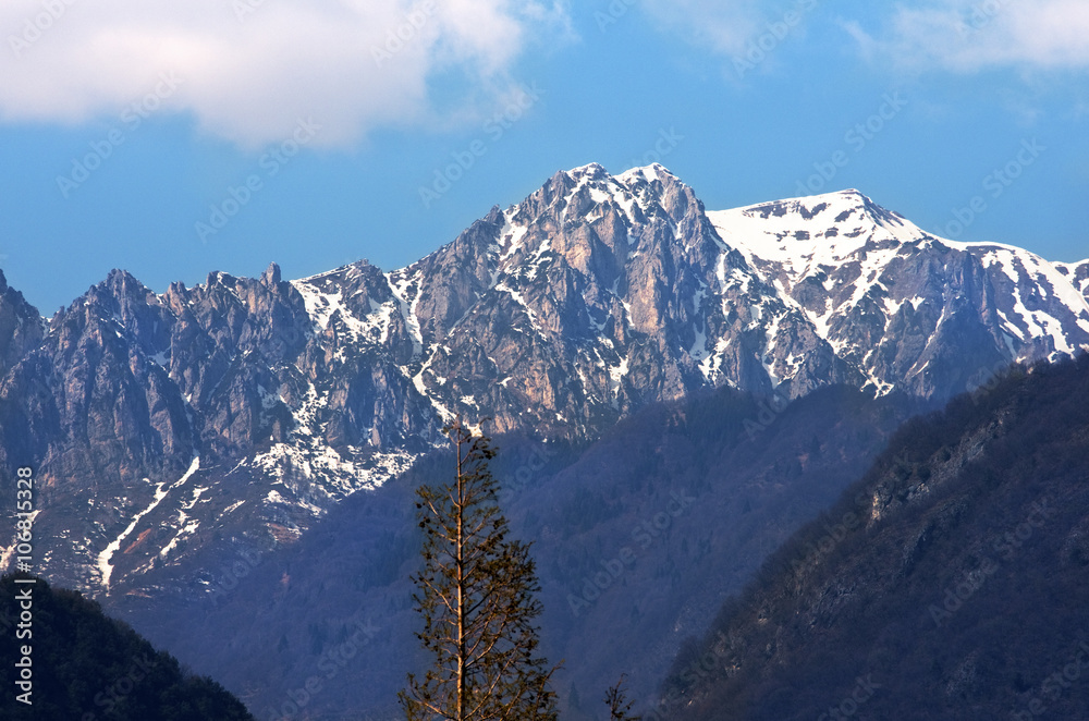 Italian Alps.Mountain Peak with snow by Garda lake in northern Italy.