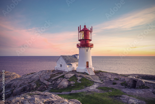 Lighthouse Lindesnes Fyr at evening on most southern point of Norway, Europe, Vintage filtered style
