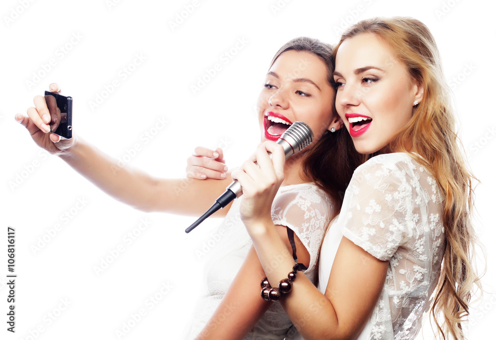 beauty girls with a microphone singing and make selfie beauty girls with a microphone singing and make selfie