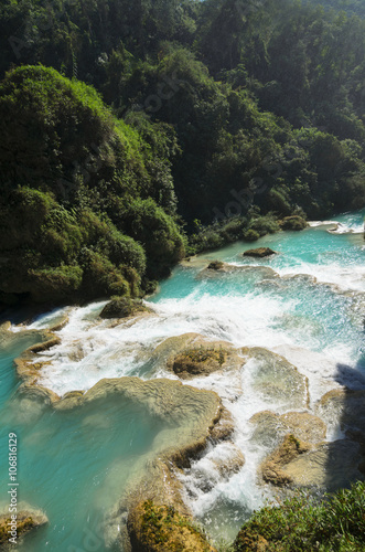 Downstream of a powerful river with turquoise pools surronded by