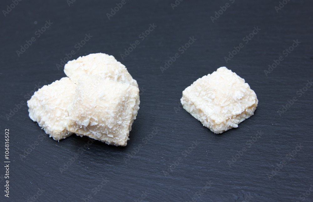 Cakes with coconut on top in slate Cakes with coconut on top in slate