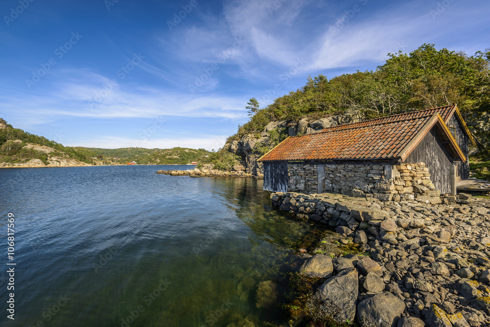 scenic fjord landscape with old boathouse in the south of Norway, Europe
