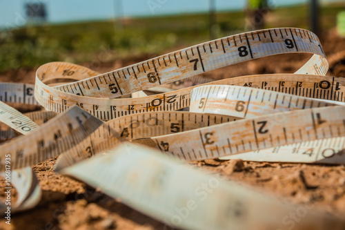Measuring tape placed on the ground at a construction site