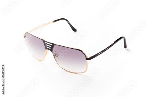 Close-up of pink sunglasses isolated over white background