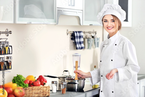 Young woman cooking in the ...
