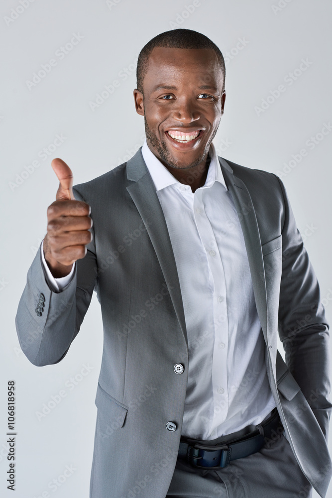 Successful black african business man in suit with thumbs up Stock