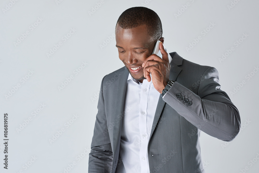 African business person in suit talking on mobil cell phone African business person in suit talking on mobil cell phone