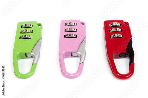 Small colorful combination locks for a bicycle or a bag, on white background