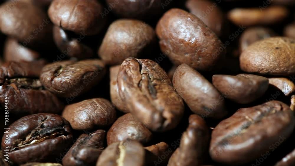 Roasted Coffee Beans on a Table Rotating. Close-up Roasted Coffee Beans on a Table Rotating. Close-up
