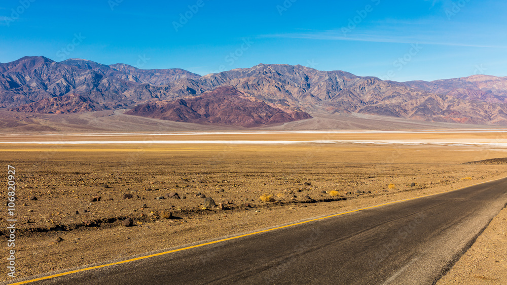 Road through canyons with lots of different topography. The road offers majestic views. It contains colorful rock formation. BADWATER RD, Death Valley National Park Road through canyons with lots of different topography. The road offers majestic views. It contains colorful rock formation. BADWATER RD, Death Valley National Park