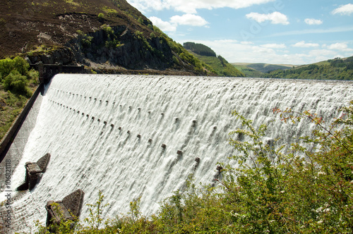 Rhayader Dams in the elan valley of Wales, UK full flow. photo