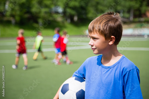 Young soccer player in training