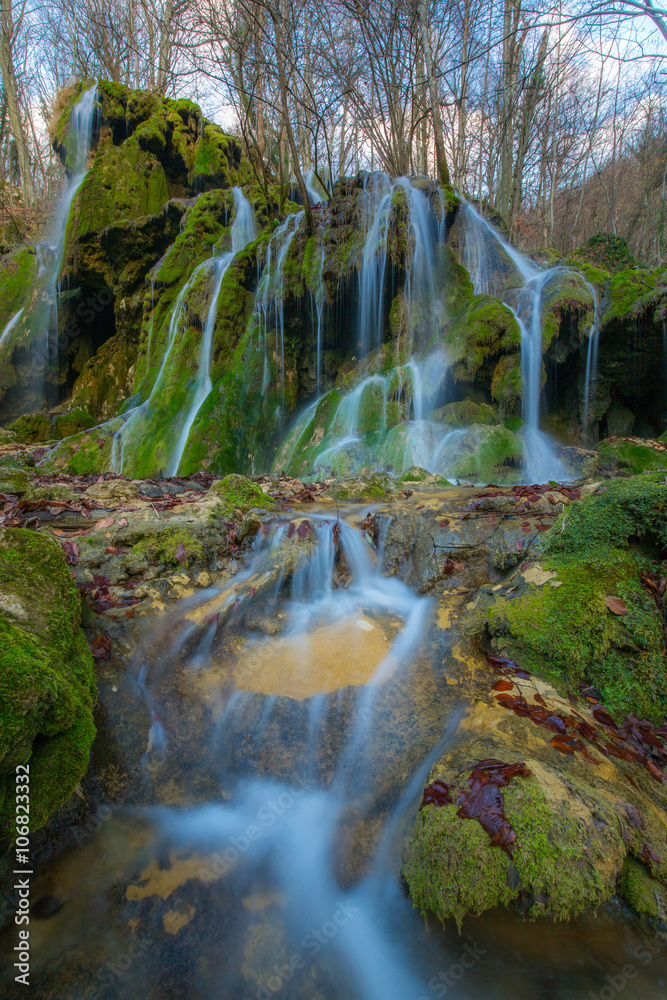 Fototapeta premium Beautiful waterfalls and mountain stream in Transylvania, in early spring