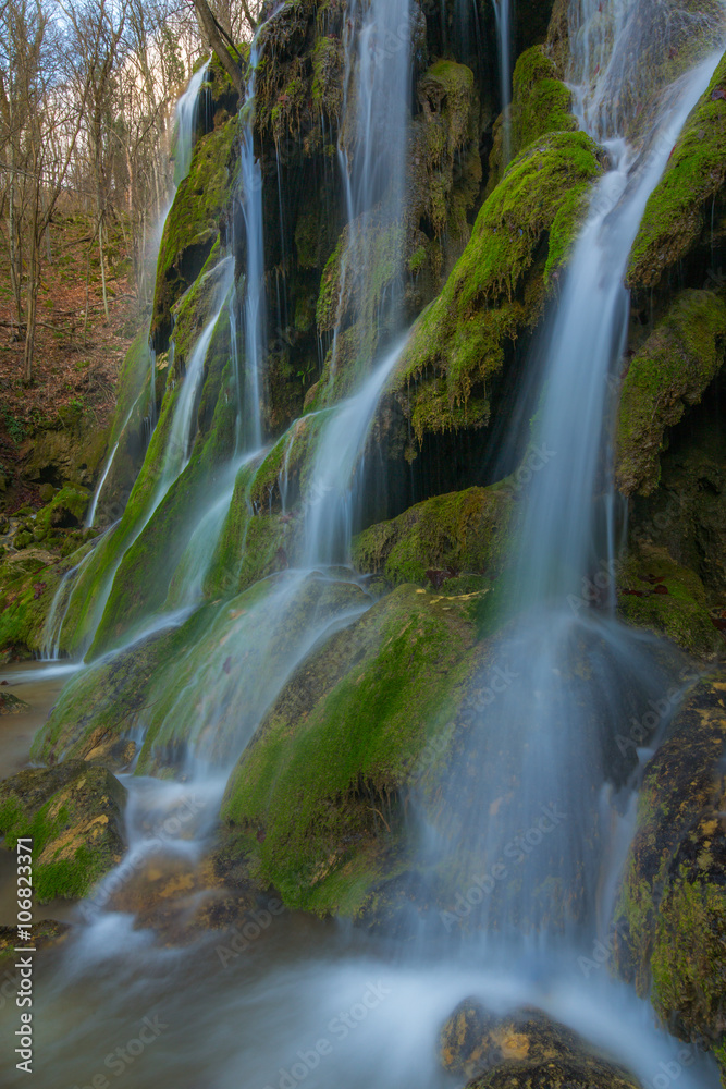 Fototapeta premium Beautiful waterfalls and mountain stream in Transylvania, in early spring