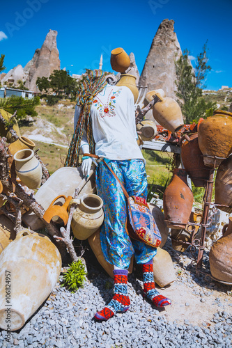 Scarecrow in Turkish countryside dressed with new clothes photo