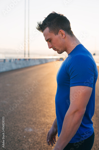 Half length portrait of muscular build handsome male posing for © Myvisuals