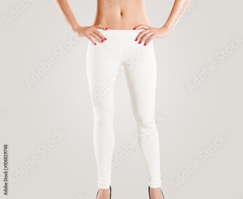 Woman wear blank white leggings mockup, isolated on grey. Women in