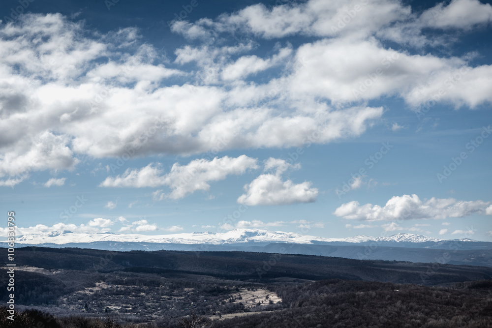 Panoramic mountain view with blue sky and clouds and snow peak Panoramic mountain view with blue sky and clouds and snow peak