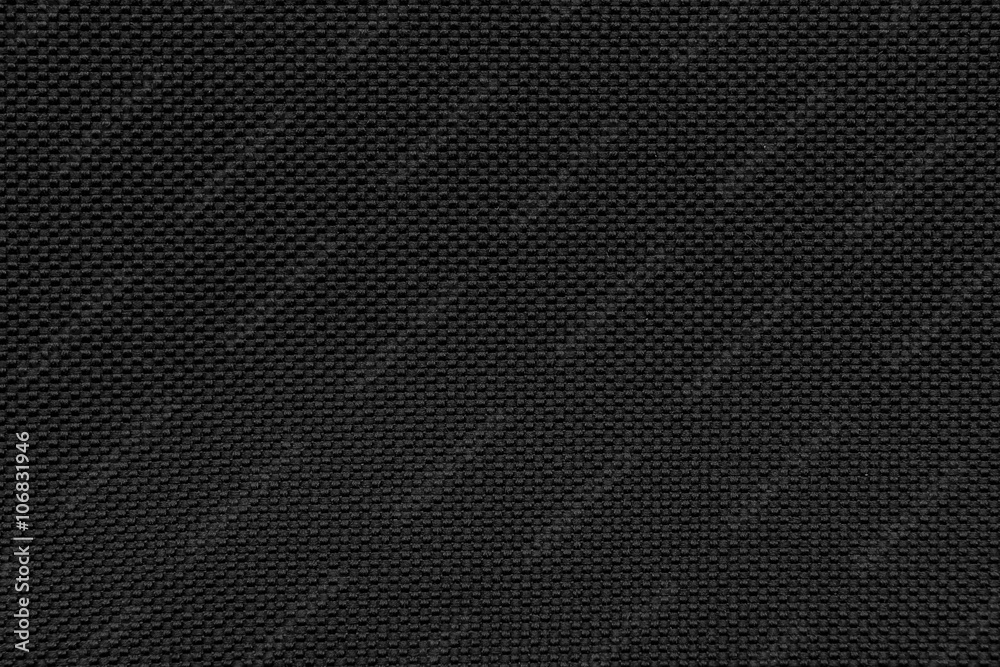 Black gray fishnet cloth material as a texture background. 